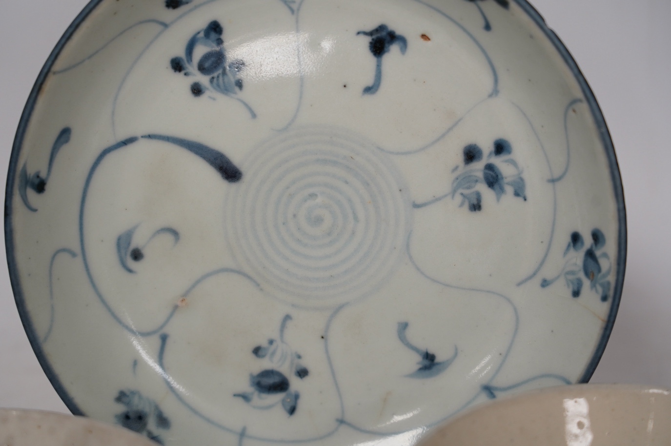 Three pieces of Chinese Teksing cargo comprising two bowls and a dish, largest 18.5cm. Condition - fair, hairline crack to dish